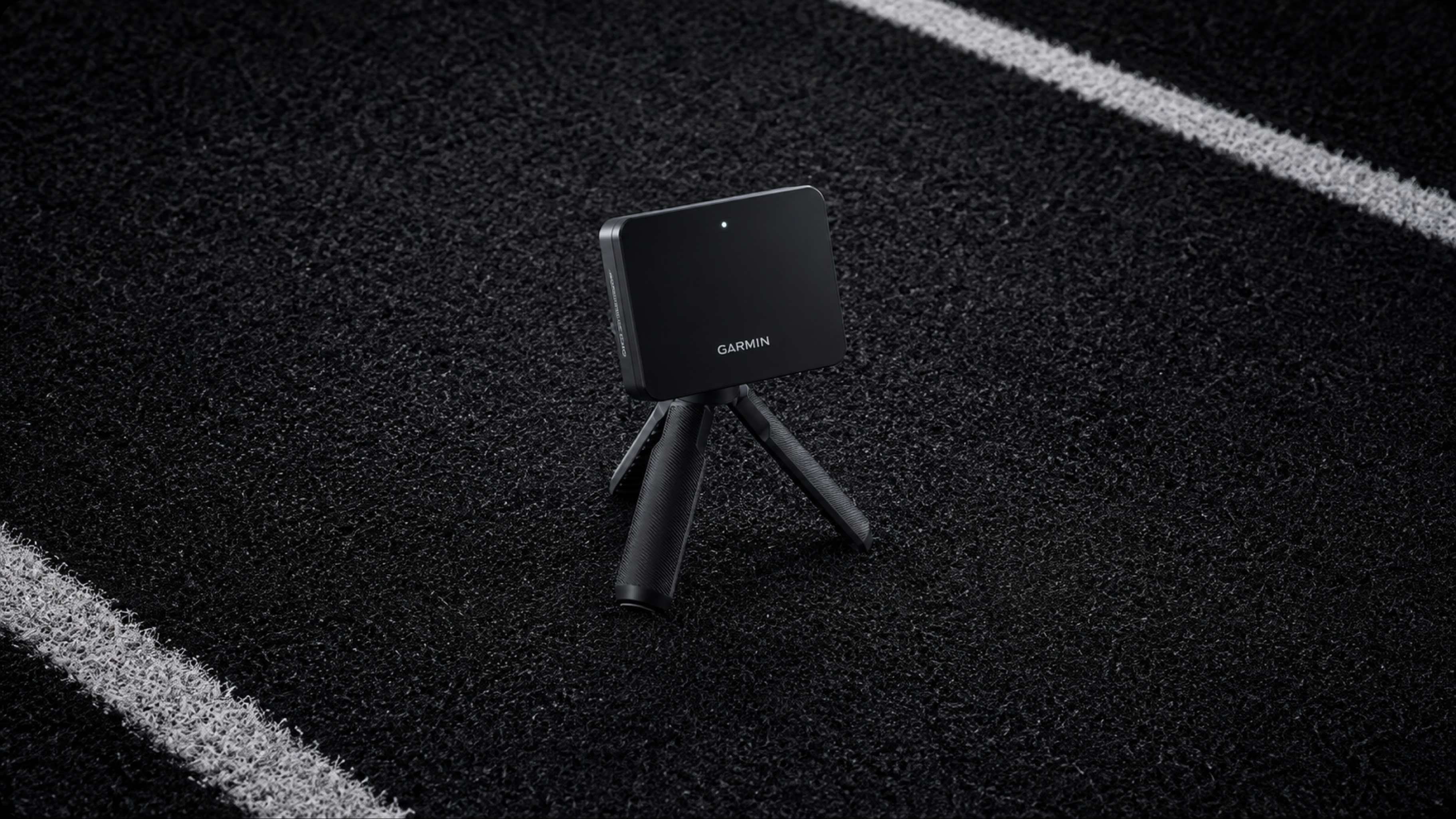 Garmin Approach R10 launch monitor on a track lane, capturing every swing